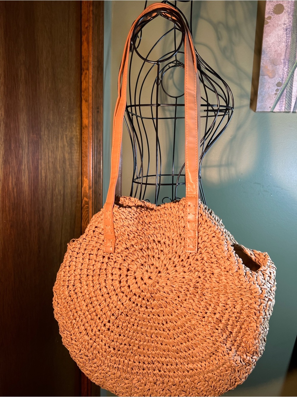 Handcrafted round woven tote bag.